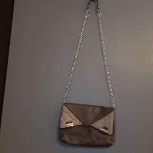 Cute envelope clutch with chain strap.